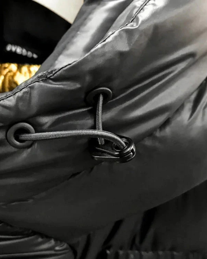 Women's Long Puffer Jacket with Hood and Quilted Panels